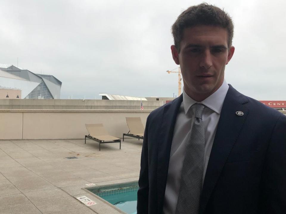 Georgia quarterback Stetson Bennett speaks on a pool deck of the Omni Hotel in Atlanta during SEC Media Days on July 20, 2022.