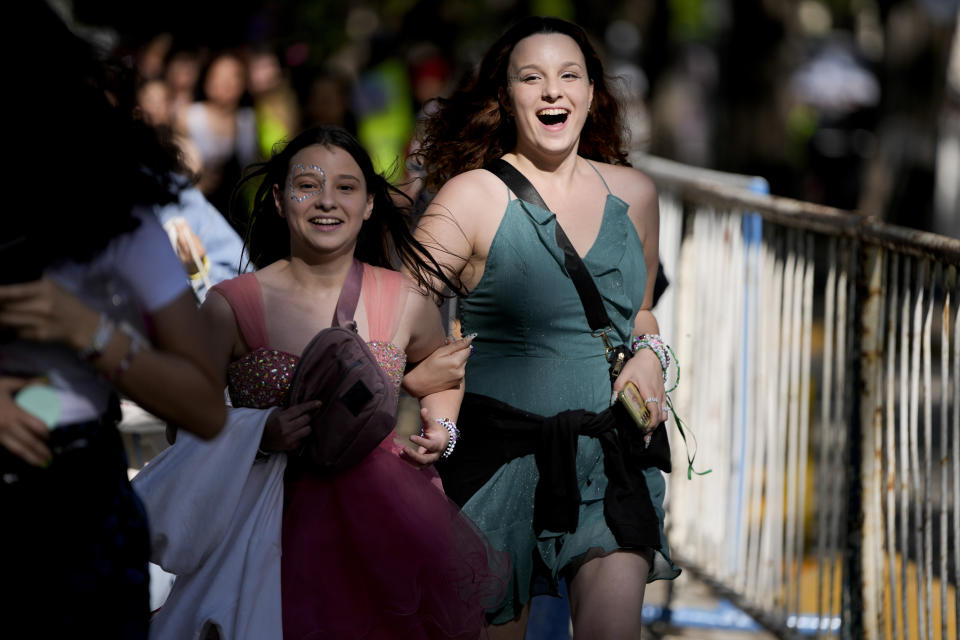 Fans make their way to the Monumental stadium to attend Taylor Swift: The Eras Tour concert, in Buenos Aires, Argentina, Thursday, Nov. 9, 2023. (AP Photo/Natacha Pisarenko)