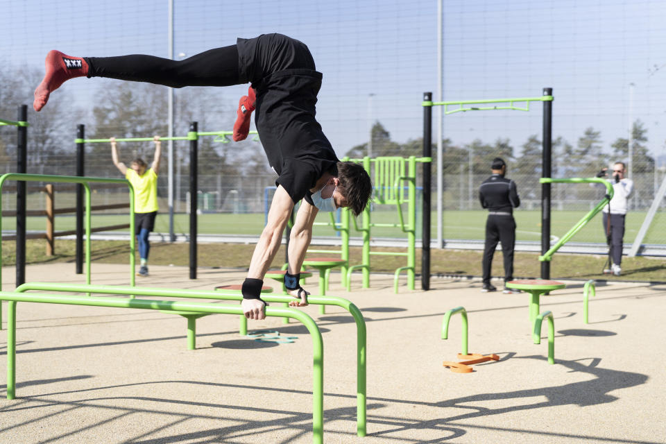 FILE - Athletes work out at a Zuerifit outdoor training facility in Zuerich, Switzerland, in this Monday, March 1, 2021, file photo. During the pandemic, people around the world sought relief from lock downs and working from home in leisure sports. (Gaetan Bally/Keystone via AP, File)