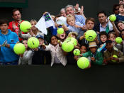 <p>Tennis fans hoping for an autograph shout towards David Ferrer of Spain as he leaves court following his victory in the Gentlemen's Singles third round match against Alexandr Dolgopolov of Ukraine on day six of the Wimbledon Lawn Tennis Championships at the All England Lawn Tennis and Croquet Club on June 29, 2013 in London, England.</p>