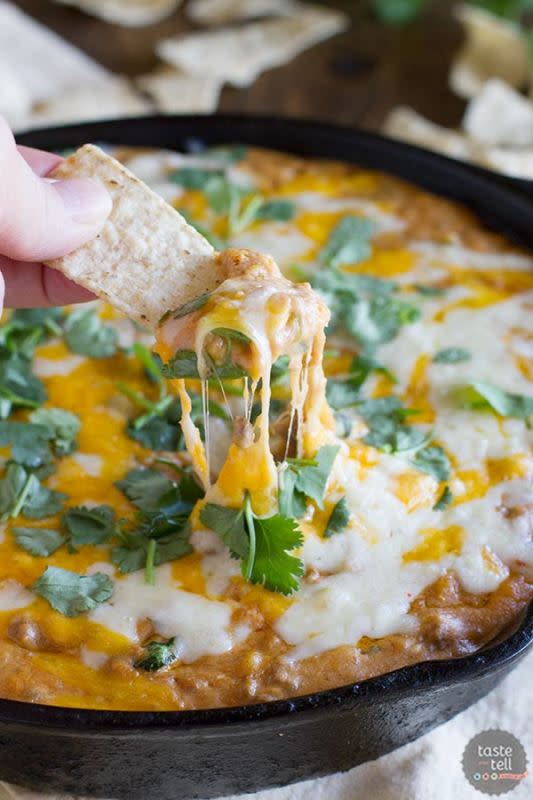 <p>Taste and Tell Blog</p><p>This addicting Hot Beef and Bean Dip that will make the whole family happy. Take your bean dip to a new level. <a href="http://www.tasteandtellblog.com/hot-beef-and-bean-dip/" rel="nofollow noopener" target="_blank" data-ylk="slk:Get the recipe HERE;elm:context_link;itc:0;sec:content-canvas" class="link ">Get the recipe HERE</a>. </p>