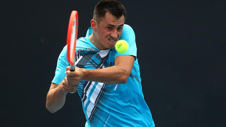 Bernard Tomic advanced to the second round after Yuichi Sugita retired hurt in the third set of their first-round match. (Photo by Mike Owen/Getty Images)