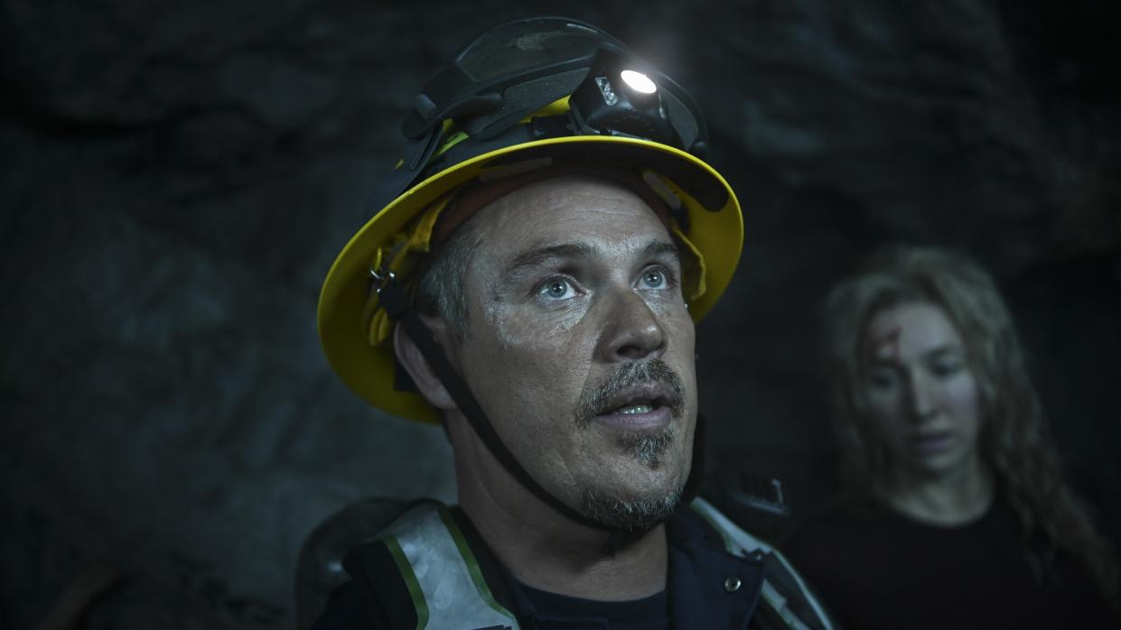  Kevin Alejandro as Manny Perez in a cave in Fire Country season 2. 