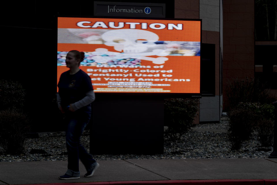 A sign cautioning against brightly colored fentanyl is displayed on a screen outside the Lummi Nation tribal headquarters, Feb. 8, 2024, near Bellingham, Wash. The Lummi Nation declared a state of emergency due to the fentanyl crisis in 2023. Washington State tribal leaders are urging state lawmakers to pass a bill that would send at least $7.75 million in funding to tribal nations to help them stem a dramatic rise in opioid overdose deaths. (AP Photo/Lindsey Wasson)