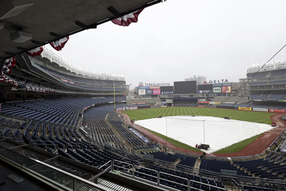 Yankee Stadium is shown as rain falls on Thursday, April 7, 2022, in New York. The New York Yankees will face the Boston Red Sox in a baseball game on Friday. (AP Photo/Adam Hunger)