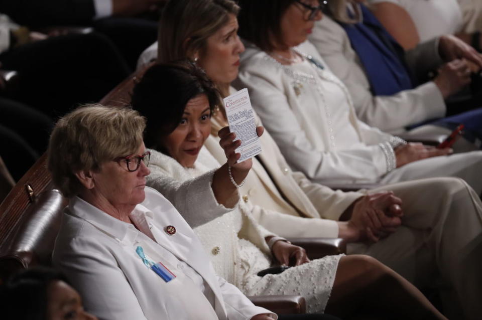 Representative Norma Torres, a Democrat from California, second left, holds up a copy of the constitution as U.S. President Donald Trump, not pictured, delivers a State of the Union address to a joint session of Congress at the U.S. Capitol in Washington, D.C., U.S., on Tuesday, Feb. 4, 2020. | Andrew Harrer/Bloomberg via Getty Images