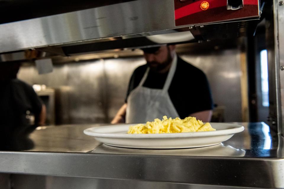 A plate of scrambled eggs is ready to be served, as cook, Tony Viejo, works in the kitchen at Aunt Judy's Family Restaurant in Doylestown Borough on Thursday, January 19, 2023.