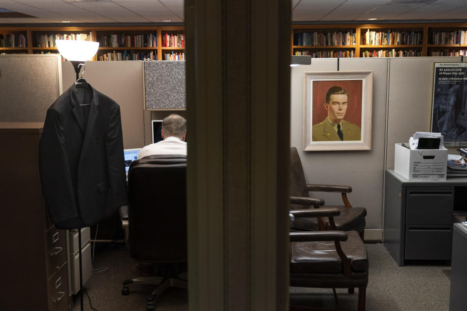 A portrait of John Birch hangs in an office cubicle at the headquarters of the John Birch Society in Appleton, Wis., Thursday, Nov. 17, 2022. The once-powerful John Birch Society is largely forgotten today, relegated to a pair of squat buildings along a busy commercial street in small-town Wisconsin. But that is only part of their story. Because outside those cramped little offices is a national political landscape that the Society helped forge. (AP Photo/David Goldman)