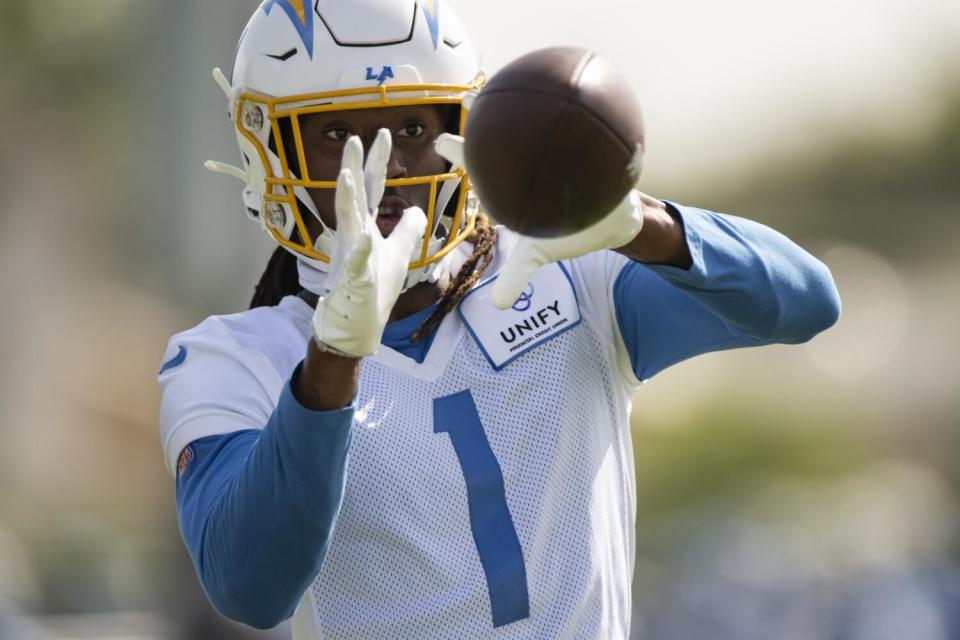 Chargers wide receiver Quentin Johnston catches a pass during practice.