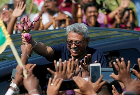 FILE PHOTO: Sri Lanka's former defense secretary Gotabaya Rajapaksa greets his supporters after his return from the United States, in Katunayake
