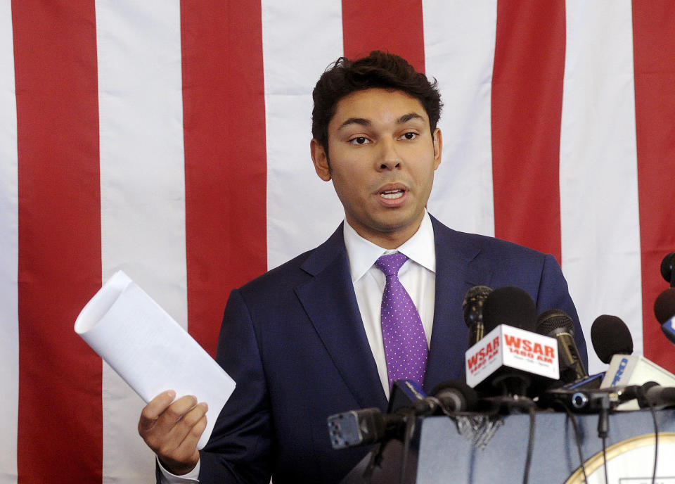 Mayor Jasiel Correia holds his five page speech that he decided not to read about his indictment during a press conference Tuesday, Oct. 16, 2018, held at the Fall River Government Center in Fall River, Mass. (Dave Souza/The Herald News of Fall River via AP)