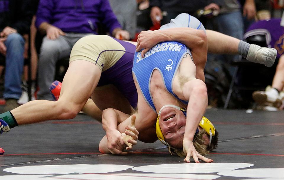 Ontario High School's Ethan Turnbaugh wrestles against Mechanicsburg High School's Westyn Moyer during their match at the super tri meet Wednesday, Dec. 8, 2021 at Crestview High School. TOM E. PUSKAR/TIMES-GAZETTE.COM