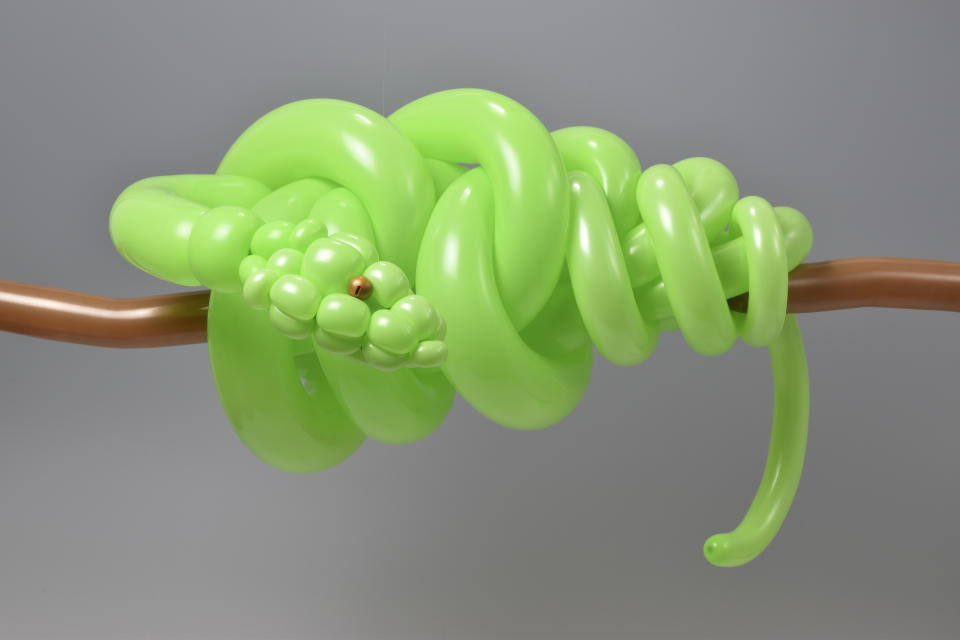 A fluorescent python by Masayoshi Matsumoto. (Photo: Masayoshi Matsumoto/Caters News)