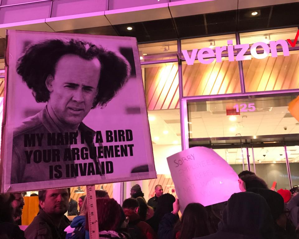 Net neutrality supporters gather at a rally in front of a Verizon store on 42nd Street in New York City on Dec. 7. (Photo: Jenna Amatulli)