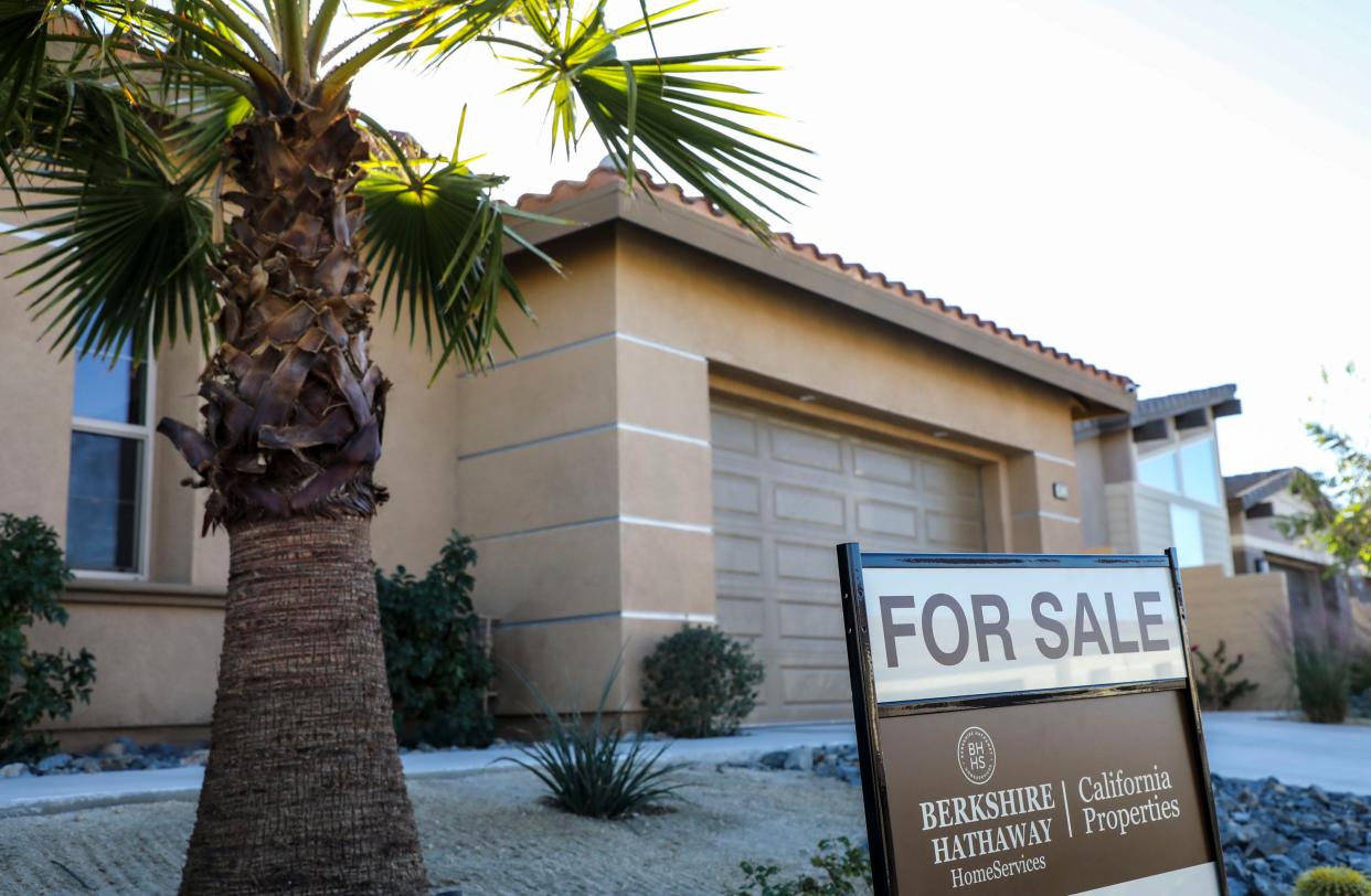 A for sale seen is seen for a home listed by Heather Partida of Berkshire Hathaway Home Services at 74313 Zeppelin Drive in Palm Desert, Calif., Tuesday, Jan. 25, 2022.
