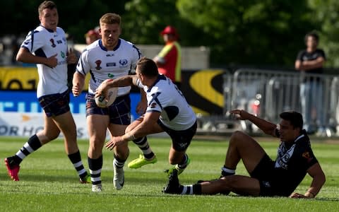 Scotland's Danny Brough passes the ball to a teammate during their Rugby League World Cup game against New Zealand in Christchurch - Credit: AP