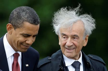 U.S. President Barack Obama (L) listens to Holocaust survivor Elie Wiesel (R) during a visit to the former Buchenwald Nazi concentration camp near the eastern German city of Weimar on June 5, 2009. REUTERS/Kai Pfaffenbach/File Photo