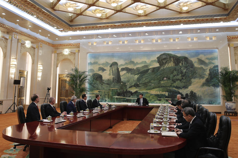 Chinese President Xi Jinping, center, meets with U.S. Trade Representative Robert Lighthizer, fifth from left, U.S. Treasury Secretary Steven Mnuchin, fourth from left, and delegations from both countries at the Great Hall of the People in Beijing, Friday, Feb. 15, 2019. (AP Photo/Andy Wong, Pool)