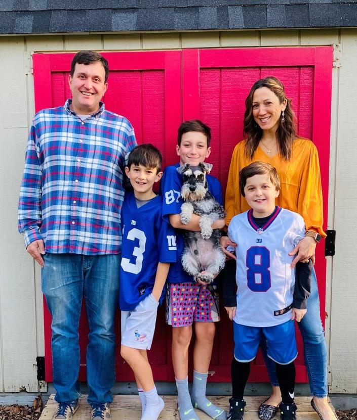 Conner Curran, right, wearing #8, his parents Chris and Jessica and brothers William (left) and Kyle.