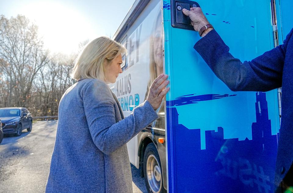 Republican gubernatorial nominee Ashley Kalus boards her campaign bus after a stop at the Johnston High School polling station.