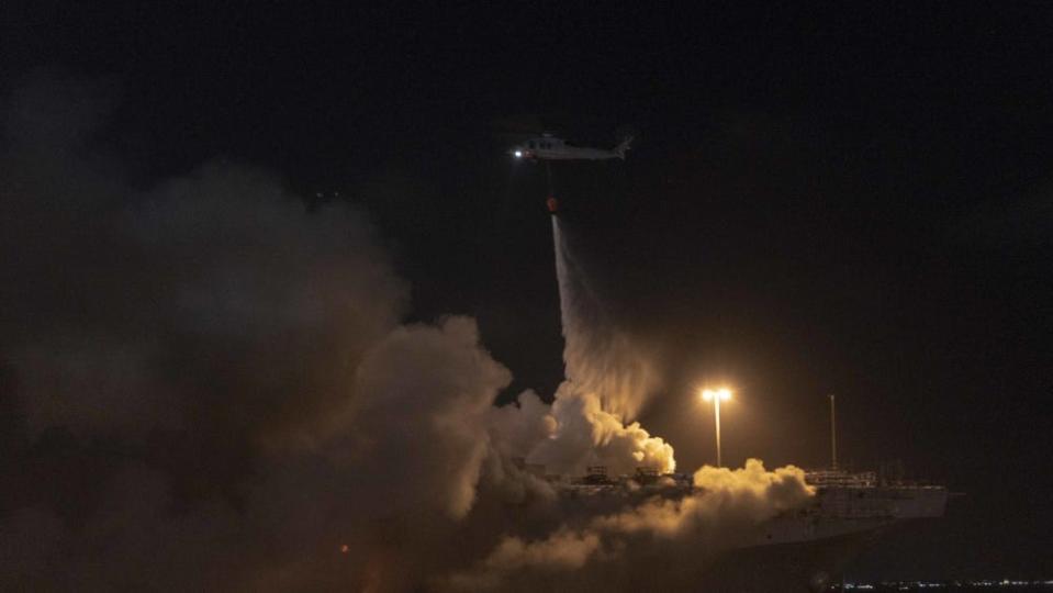 Firefighters battle a fire aboard the US Navy amphibious assault ship USS Bonhomme Richard