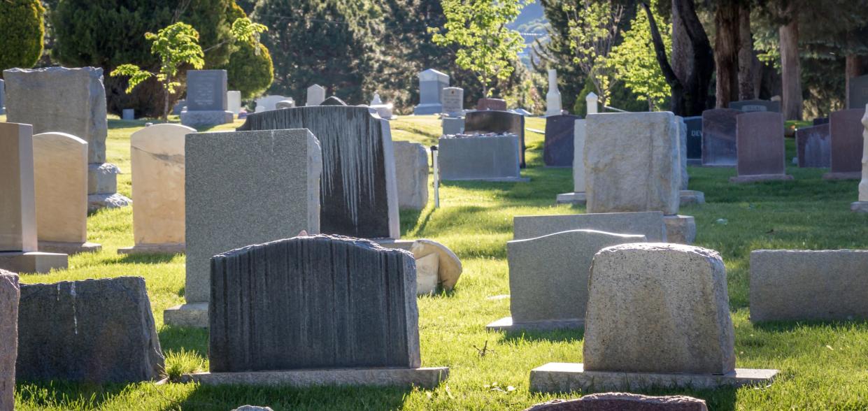 Headstones in a cemetery during the day