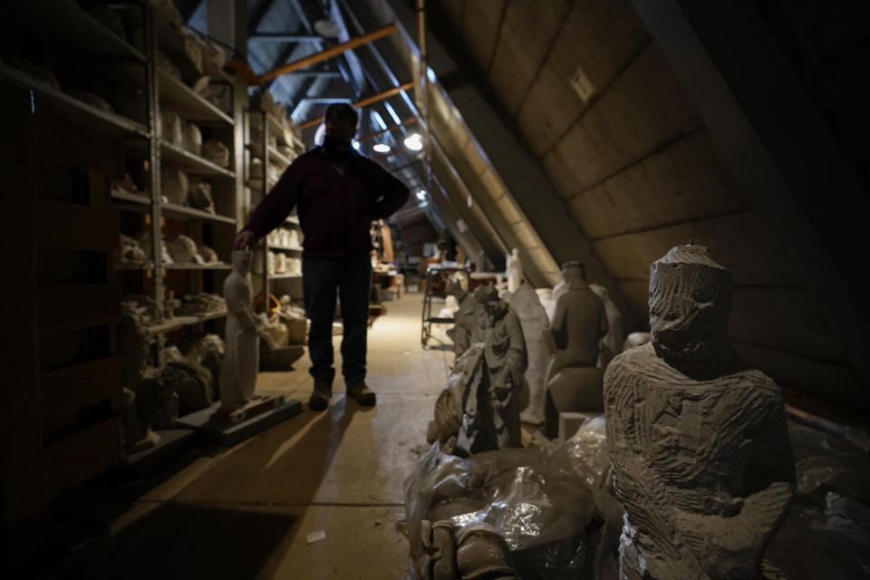 Stone carver Sean Callahan stands among construction archives at the Washington National Cathedral, Friday, March 19, 2021. (AP Photo/Carolyn Kaster)
