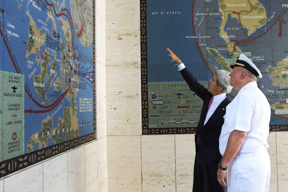 U.S. Secretary of State John Kerry and Superintendent Larry Adkison look at a map of the World War II Battle for Leyte Gulf at the Manila American Cemetery in Manila