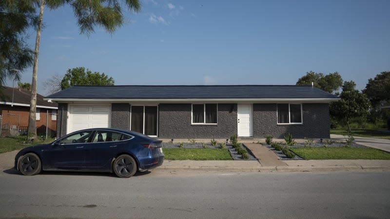 A home with a Tesla Solar Roof on Weems Street in Boca Chica Village, Texas, U.S., on Monday, June 21, 2021.