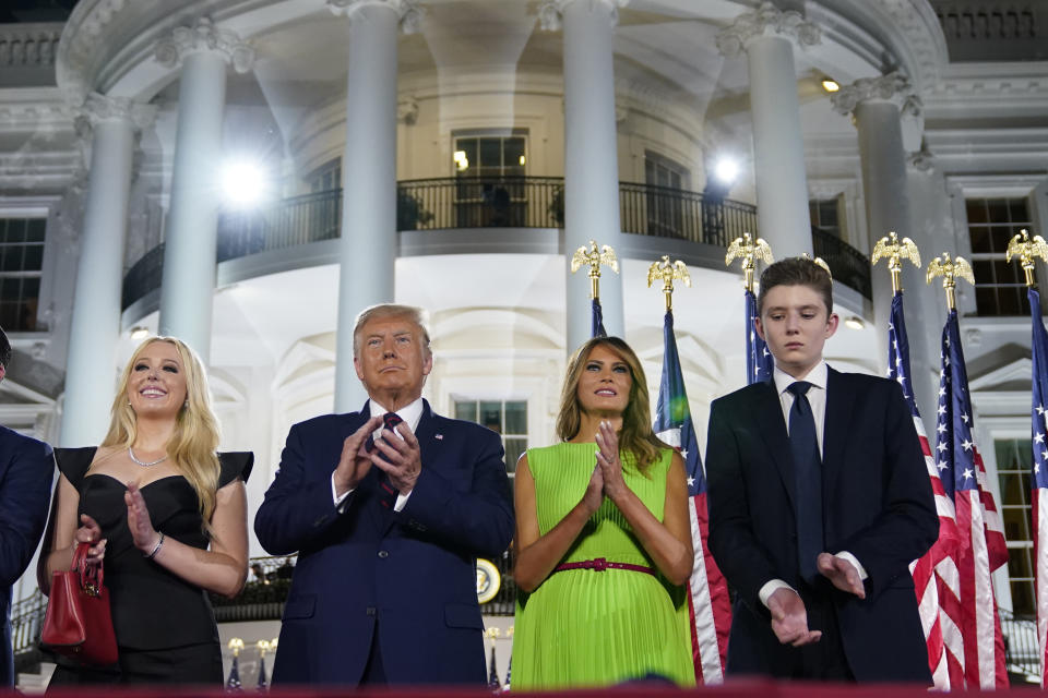 From left, Tiffany Trump, President Donald Trump, first lady Melania Trump and Barron Trump stand on stage on the South Lawn of the White House on the fourth day of the Republican National Convention, Thursday, Aug. 27, 2020, in Washington. (AP Photo/Evan Vucci)