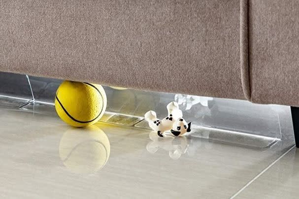 A sturdy toy blocker to stop objects from going into the abyss underneath your furniture