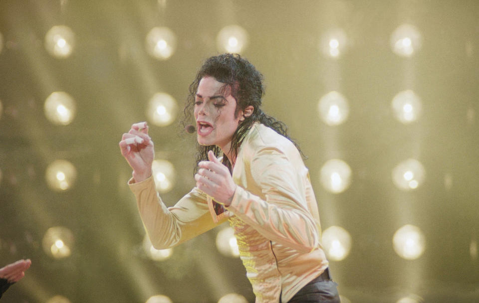 American entertainer Michael Jackson sings during his first and only concert in the former Soviet Union on a rainy night at Moscow’s Olympic Stadium in Moscow, Wednesday, Sept. 15, 1993. (AP Photo/Alexander Zemlianichenko)