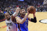 Oklahoma City Thunder center Enes Kanter, right, of Turkey, shoots as Los Angeles Clippers center Marreese Speights defends during the first half of an NBA basketball game, Monday, Jan. 16, 2017, in Los Angeles. (AP Photo/Mark J. Terrill)