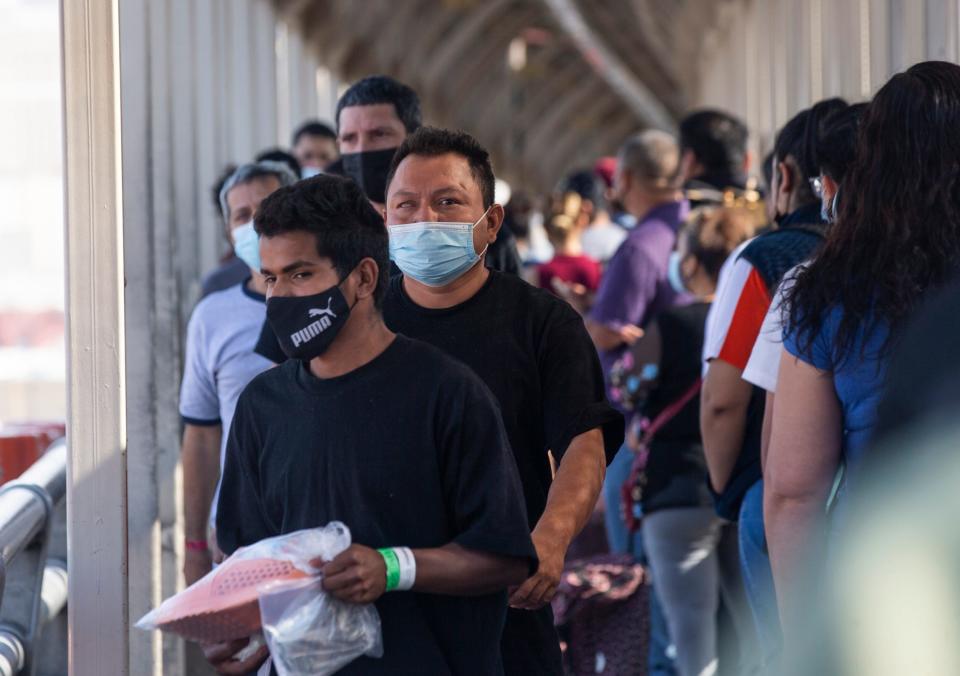 Migrants are expelled to Ciudad Juarez by Customs and Border Protection on the Paso del Norte International Bridge under Title 42 on May 18, 2022.