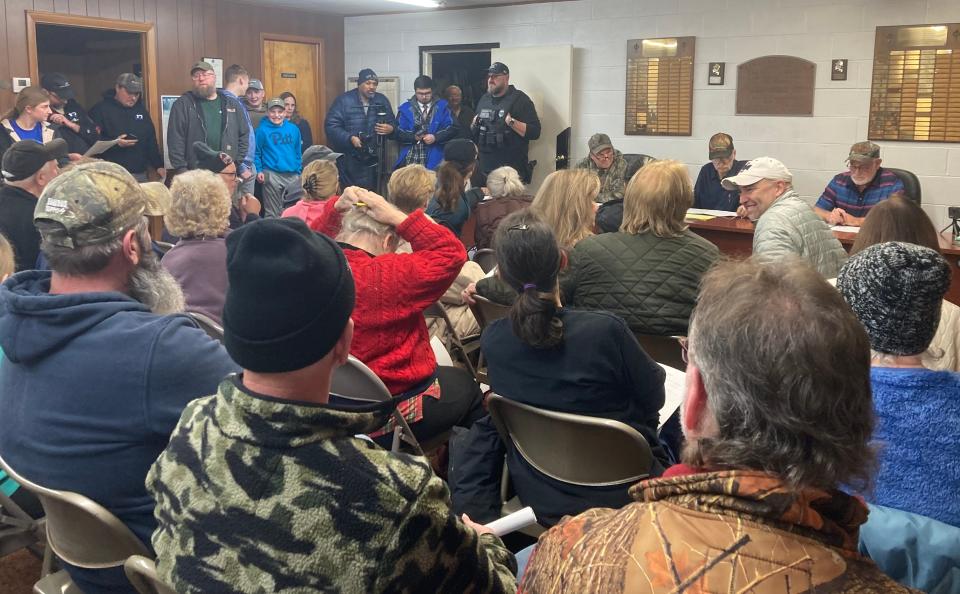 Venango Township Supervisors D.J. Austin, Dean Curtis and Mike Vogel, seated at front, from left, voted Monday to reject an application to build a massive solar farm in the township.