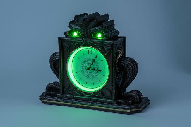 <p>Courtesy Disney</p> Cruisers can shop exclusive merch aboard the Disney Treasure, including this Haunted Mansion-inspired mantle clock.