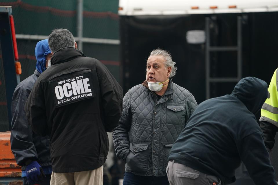 Members of the NYC Medical Examiner's Office at the site as workers build a makeshift morgue outside of Bellevue Hospital to handle an expected surge in Coronavirus victims on March 25, 2020 in New York.