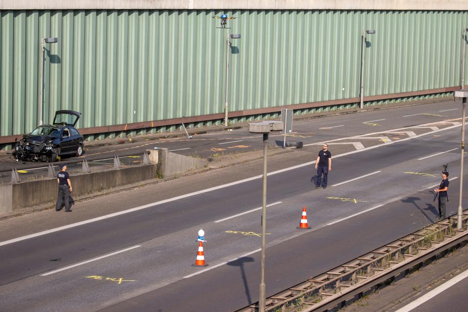 Police investigators fly a drone at the site where a motorcycle crashed with a car, probably the car used by an alleged offender to cause several accidents on the A 100 highway in Berlin on August 19, 2020. - A man caused a series of motorway accidents in Berlin on Tuesday night, injuring six people including three seriously in what German prosecutors have described as an Islamist act. (Photo by Odd ANDERSEN / AFP) (Photo by ODD ANDERSEN/AFP via Getty Images)