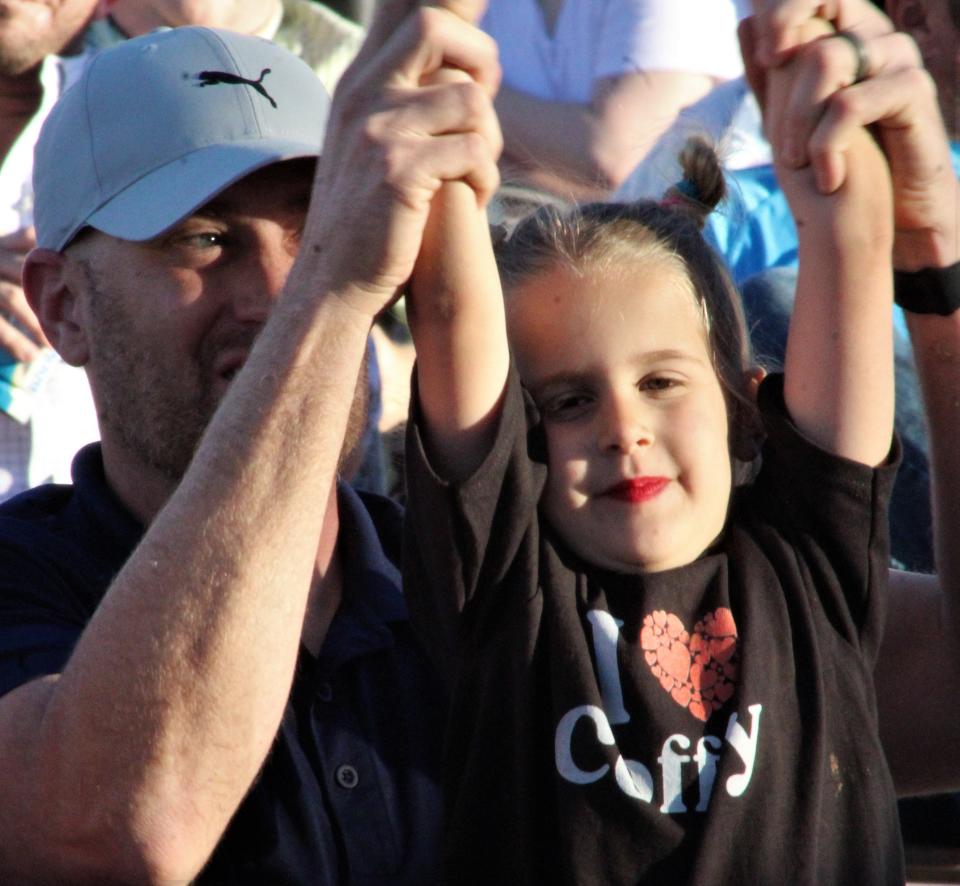 Cam Holson of Buffalo Gap holds daughter Hazel, 5, wearing her Coffey Anderson T-shirt during the singer's show Thursday in Tuscola. They are from Buffalo Gap.