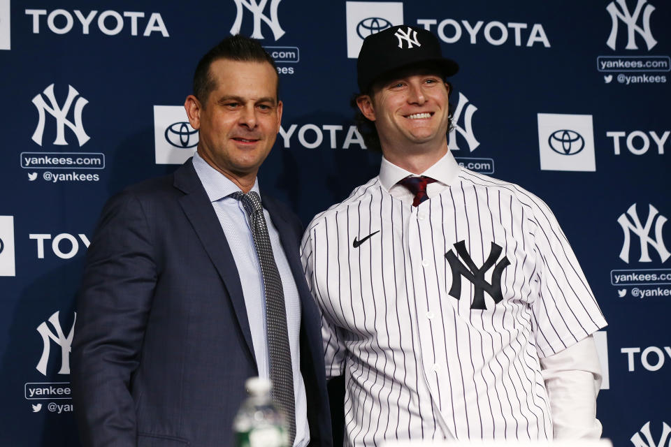 NEW YORK, NEW YORK - DECEMBER 18: Gerrit Cole and Manager, Aaron Boone of the New York Yankees pose for a photo at Yankee Stadium during a press conference at Yankee Stadium on December 18, 2019  in New York City. (Photo by Mike Stobe/Getty Images)