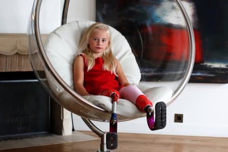 Model Daisy-May Demetre, 9 year-old double amputee who will walk the runway during Paris Fashion Week, poses for a photograph a day before the luxury children's wear label Lulu et Gigi show in Paris