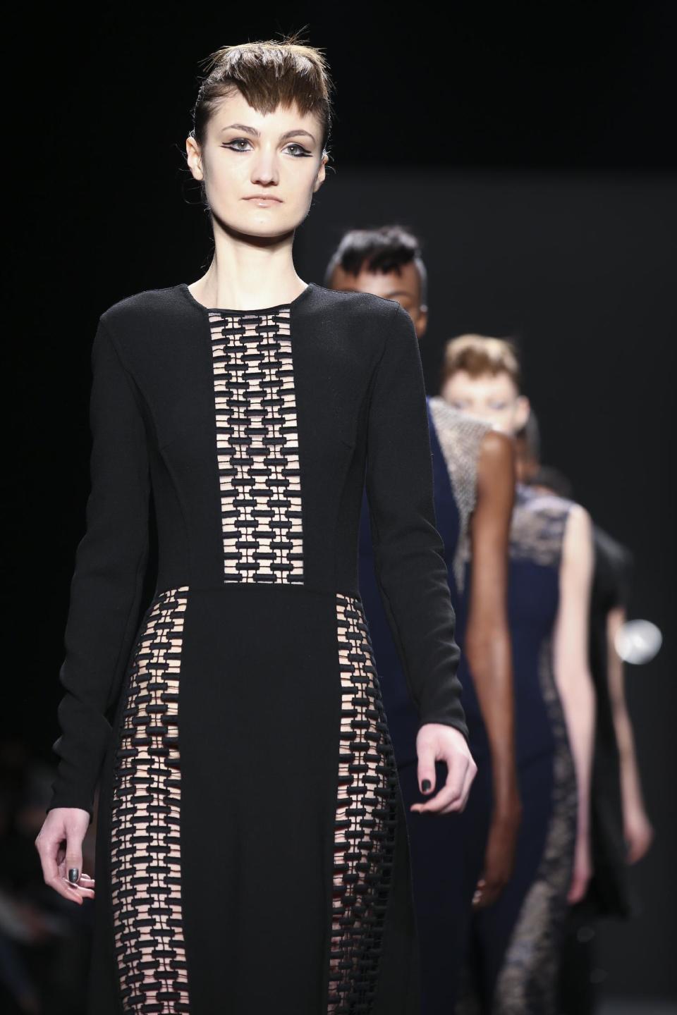 The Carmen Marc Valvo Fall 2014 collection is modeled during Fashion Week, Friday, Feb. 7, 2014, in New York. (AP Photo/John Minchillo)