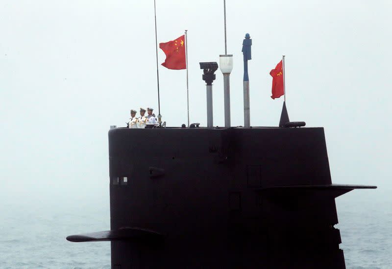 FILE PHOTO: A Chinese Navy's submarine takes part in a naval parade off the eastern port city of Qingdao to mark the 70th anniversary of the founding of Chinese People's Liberation Army Navy
