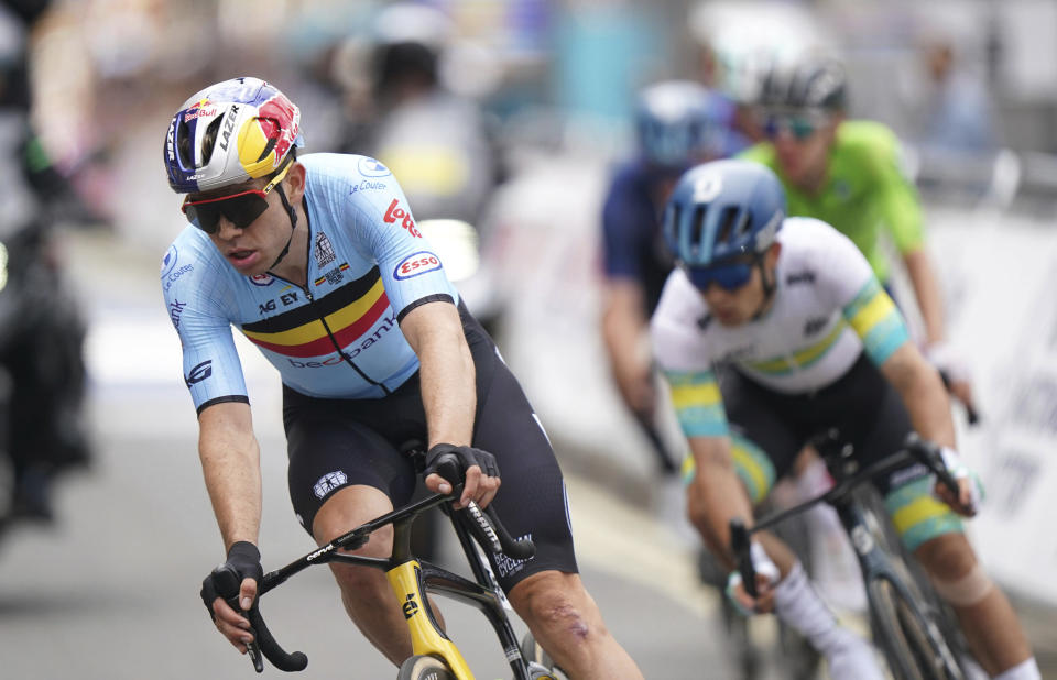 Belgium's Wout van Aert, left, pedals during the Men's Elite Road Race on day four of the 2023 UCI Cycling World Championships in Glasgow, Scotland, Sunday Aug. 6, 2023. (Tim Goode/PA via AP)