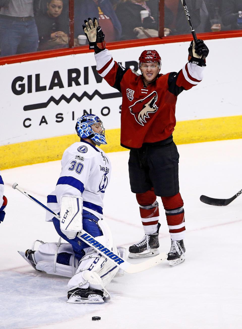 Arizona Coyotes right wing Christian Fischer, right, celebrates a goal in his first NHL hockey game, against Tampa Bay Lightning goalie Ben Bishop (30) during the second period Saturday, Jan. 21, 2017, in Glendale.