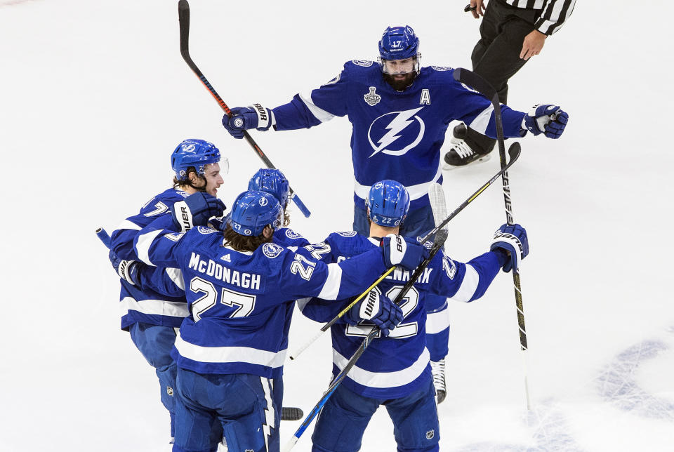 Tampa Bay Lightning' Kevin Shattenkirk (22) celebrates his goal with teammates during first-period NHL Stanley Cup finals hockey action against the Dallas Stars in Edmonton, Alberta, Monday, Sept. 21, 2020. (Jason Franson/The Canadian Press via AP)