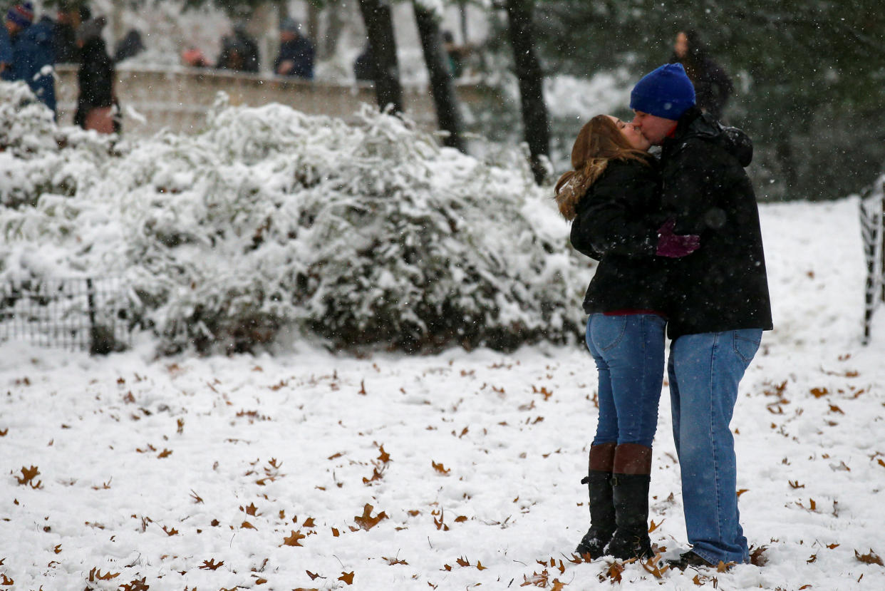 A couple kiss as the snow falls in Central Park (REUTERS)