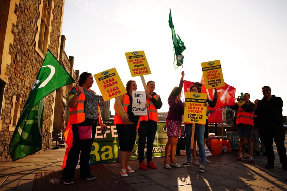 Members of the Rail, Maritime and Transport union on the picket line outside Bristol Temple Meads station (Ben Birchall/PA) (PA Wire)