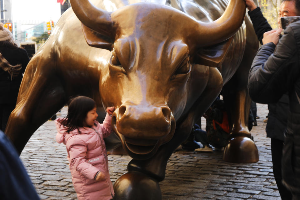 NEW YORK, NEW YORK - NOVEMBER 08: People take photos in front of the "Charging Bull" statue in lower Manhattan on November 08, 2019 in New York City. Citing safety concerns as it is often the site of protests, New York city officials announced Thursday that they are moving the iconic to a new location sculpture. The 7,000-pound statue was originally placed outside of the New York Stock Exchange in 1989 before being moved down the street to Bowling Green Park. (Photo by Spencer Platt/Getty Images)