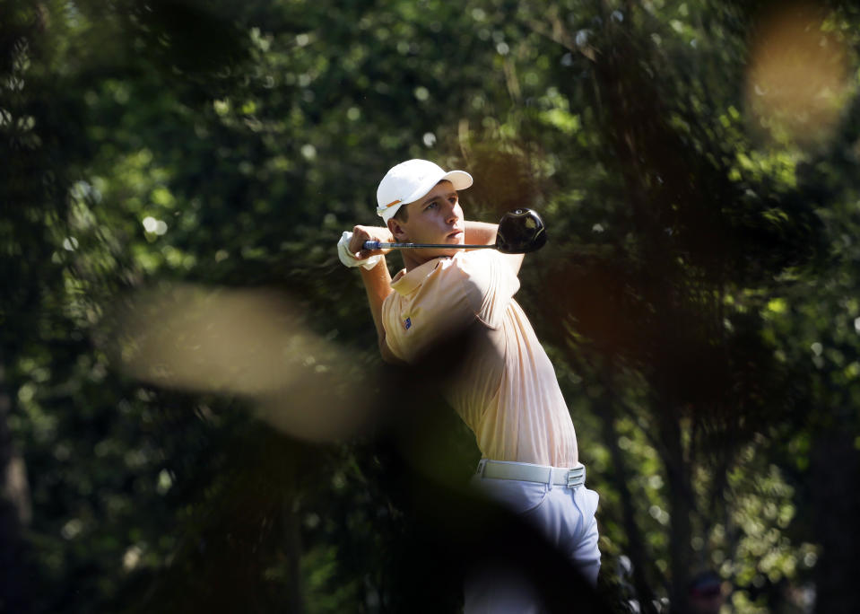 Oliver Goss, of Australia, tees off on the second hole during the third round of the Masters golf tournament Saturday, April 12, 2014, in Augusta, Ga. (AP Photo/David J. Phillip)